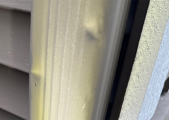 Hail damage to gutters and downspouts