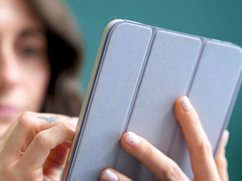 Holding ipad in case writing notes