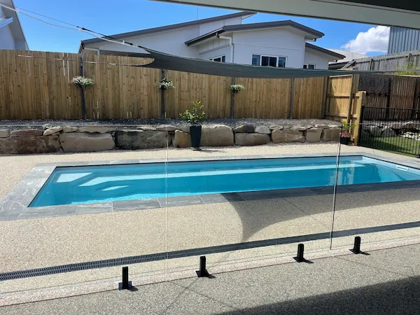 Narrow family pool with frameless glass fencing