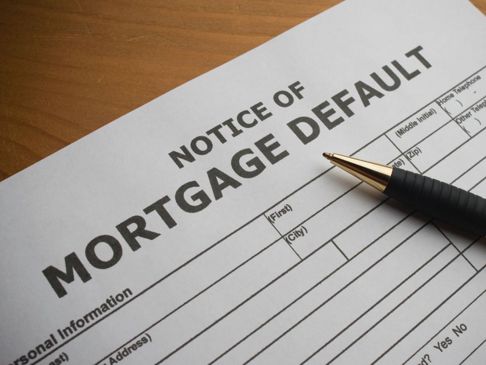 A notice of mortgage default on a desk