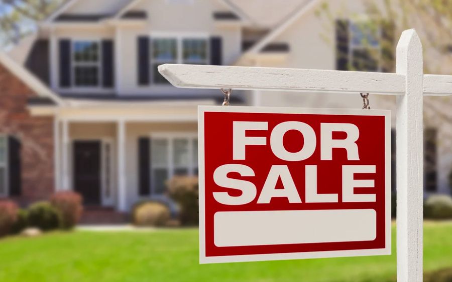 A home with a For Sale sign