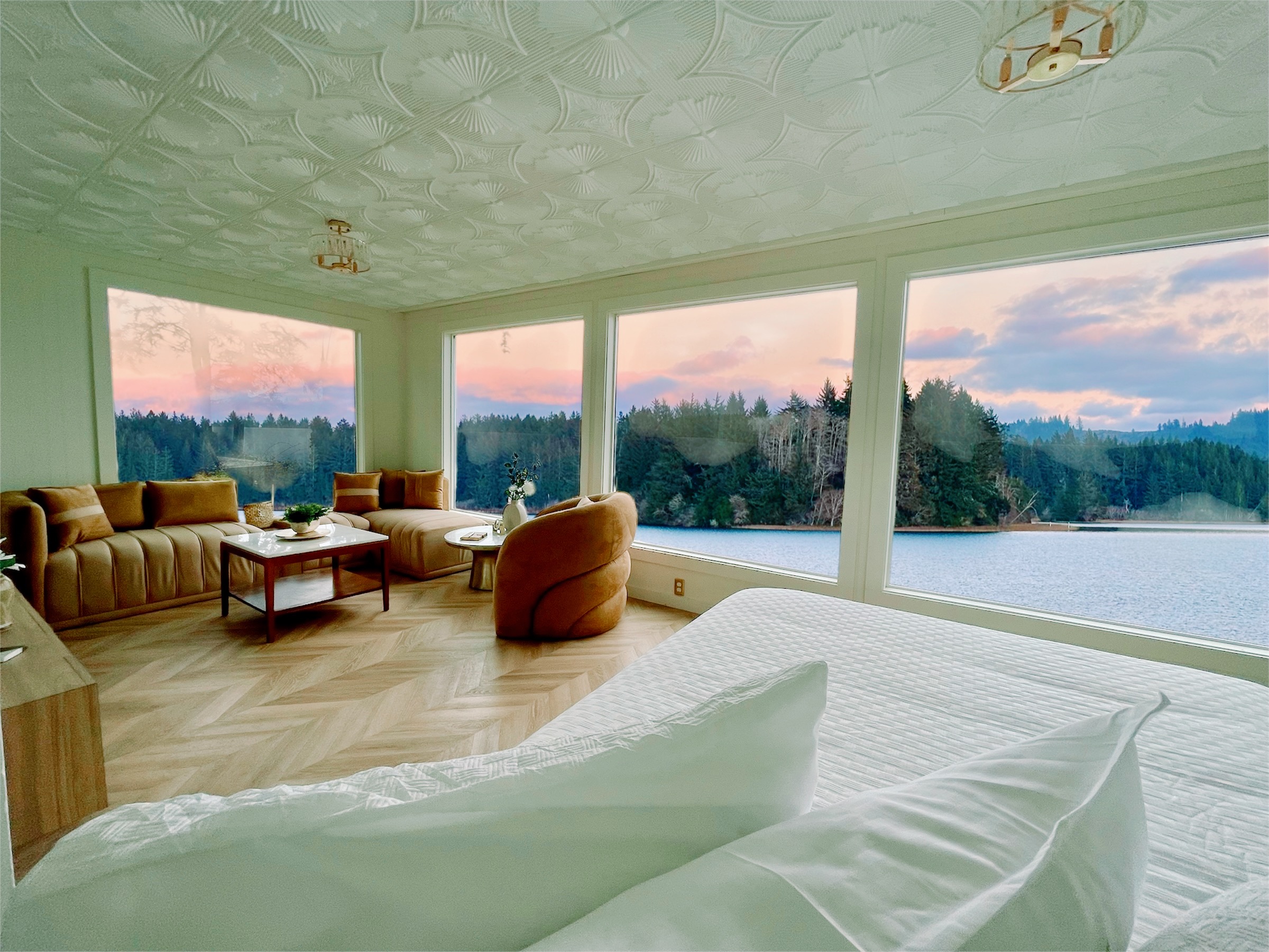 Vanilla Villa luxury cabin rental on the Oregon Coast with canopy bed and floor-to-ceiling lake view windows Vanilla Villa luxury cabin rental on the Oregon Coast with canopy bed and floor-to-ceiling lake view windows