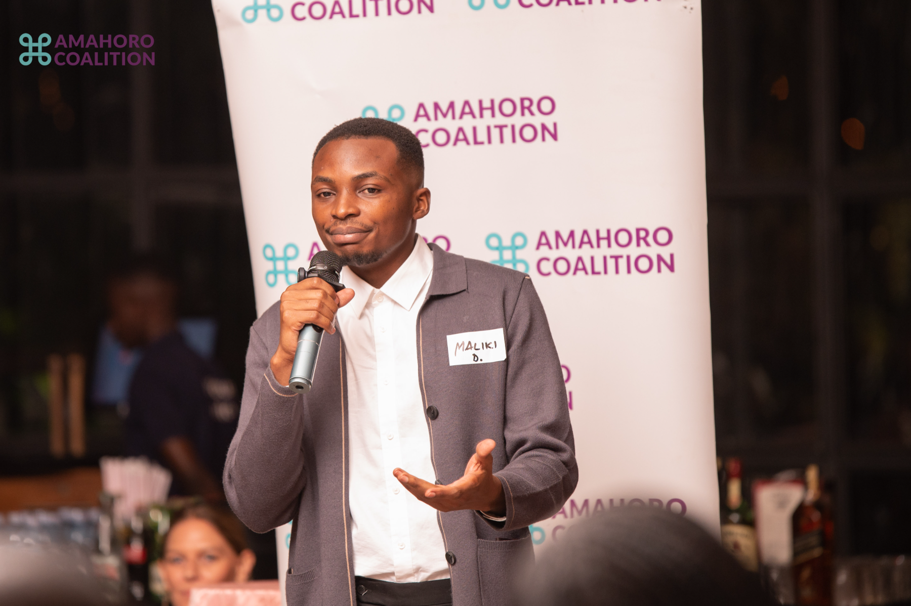 Didier Maliki speaking at an event