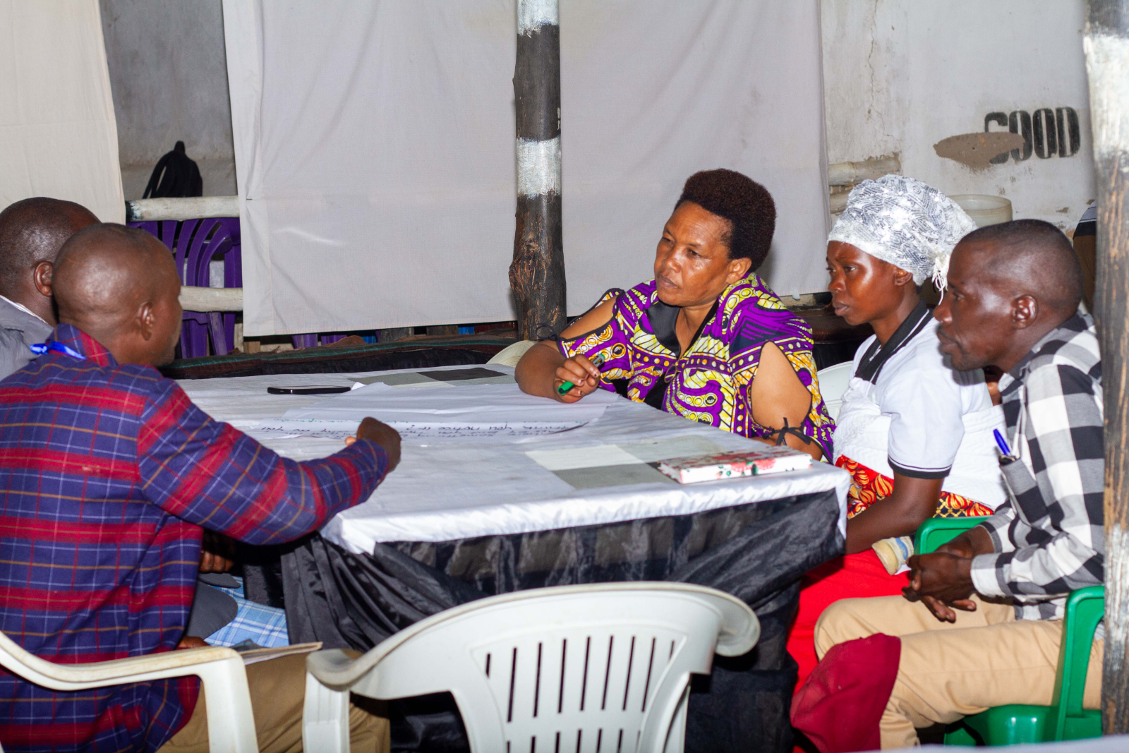 Community members planning together around a table