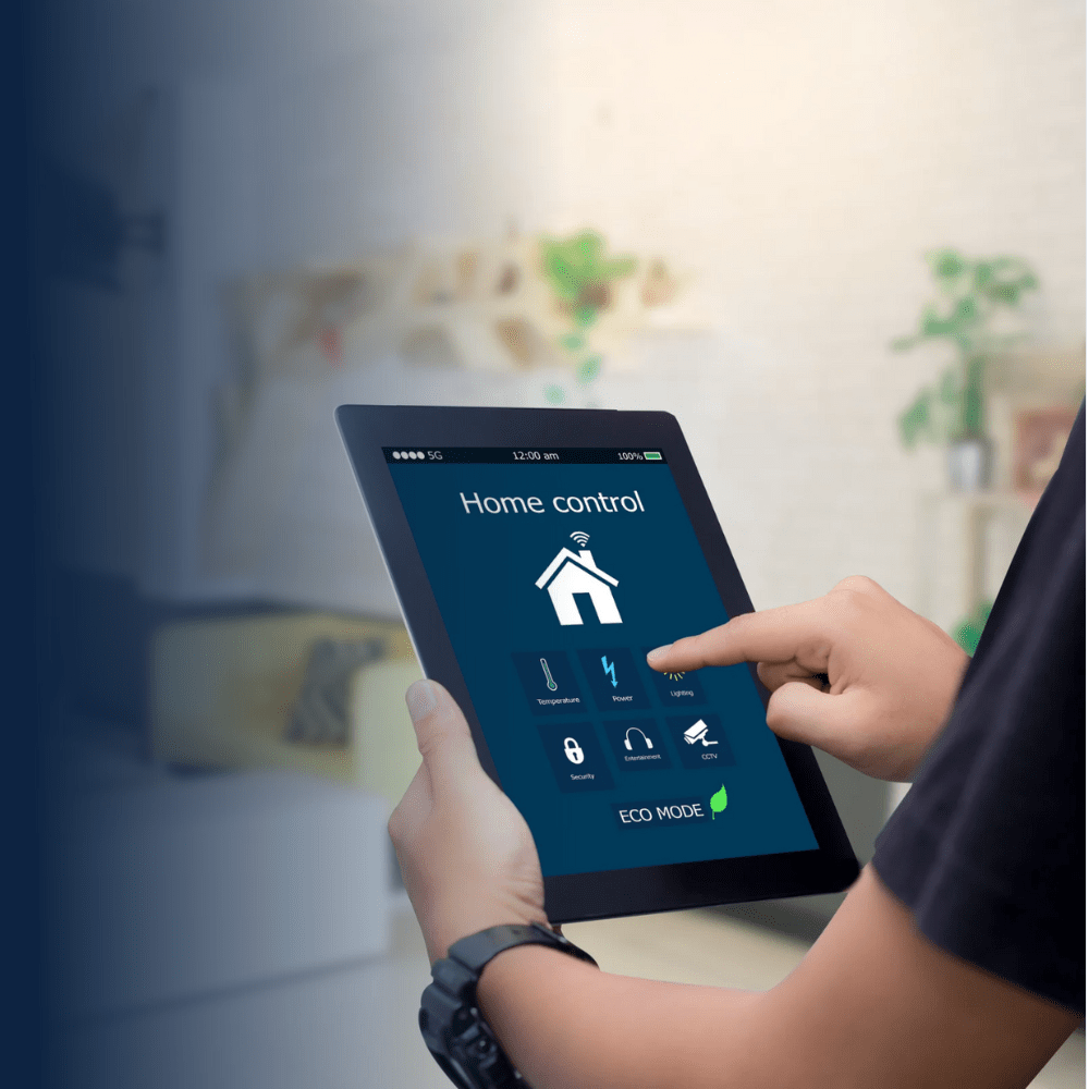 Engineer operating smart home control tablet to integrate motorized screens with building automation protocols following technical guidelines and specifications