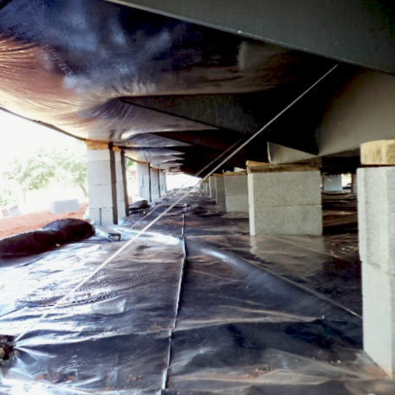 A set of newly installed, rust-resistant mobile home tie-downs securing a home in Bradenton for hurricane season.