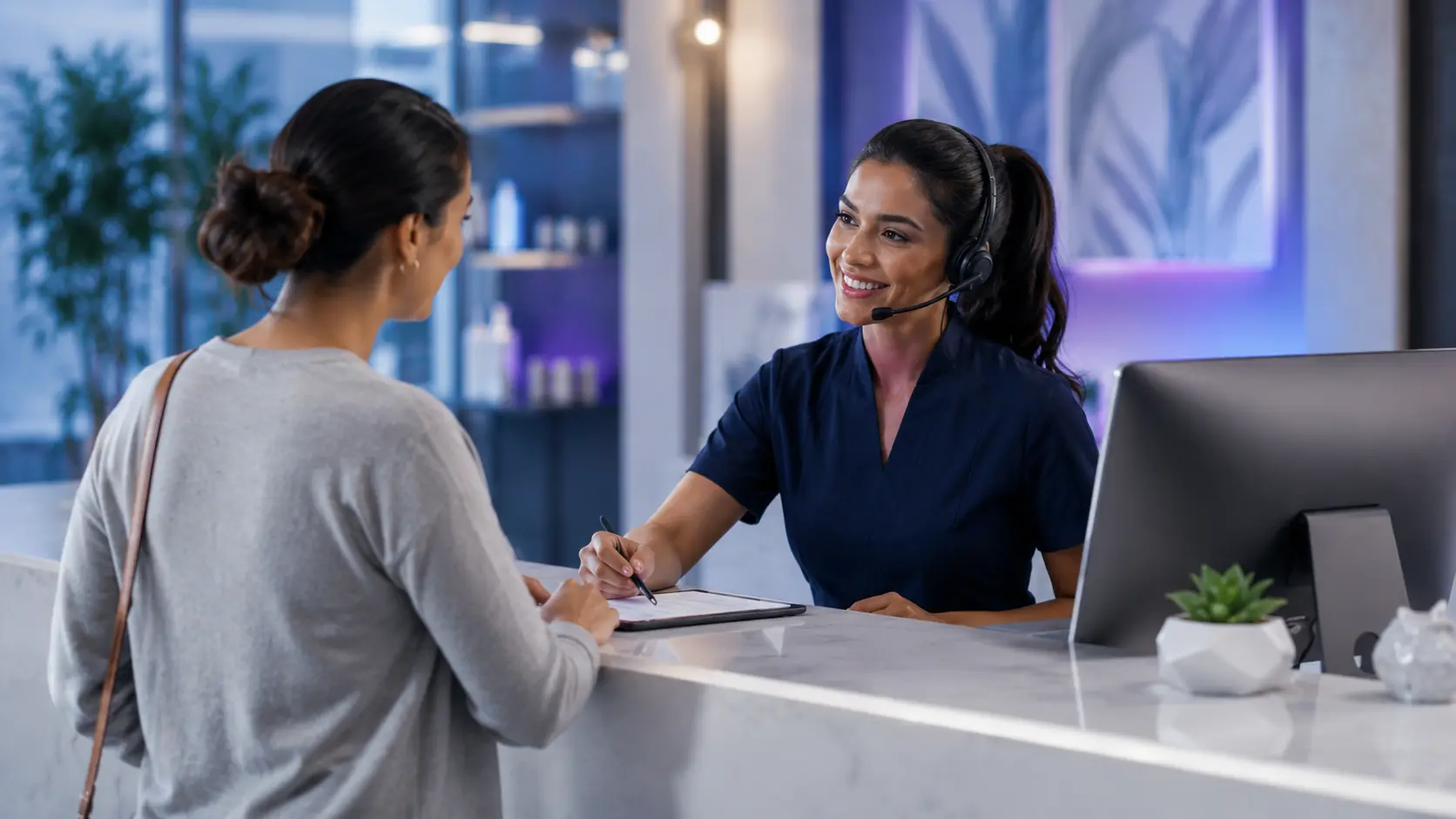 Health and wellness front desk welcoming a patient