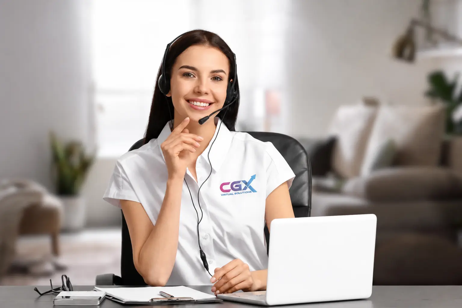 Remote professional working from home with a headset and laptop