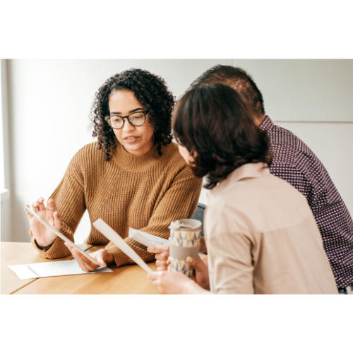 Long-term care insurance specialist reviewing plan options with clients