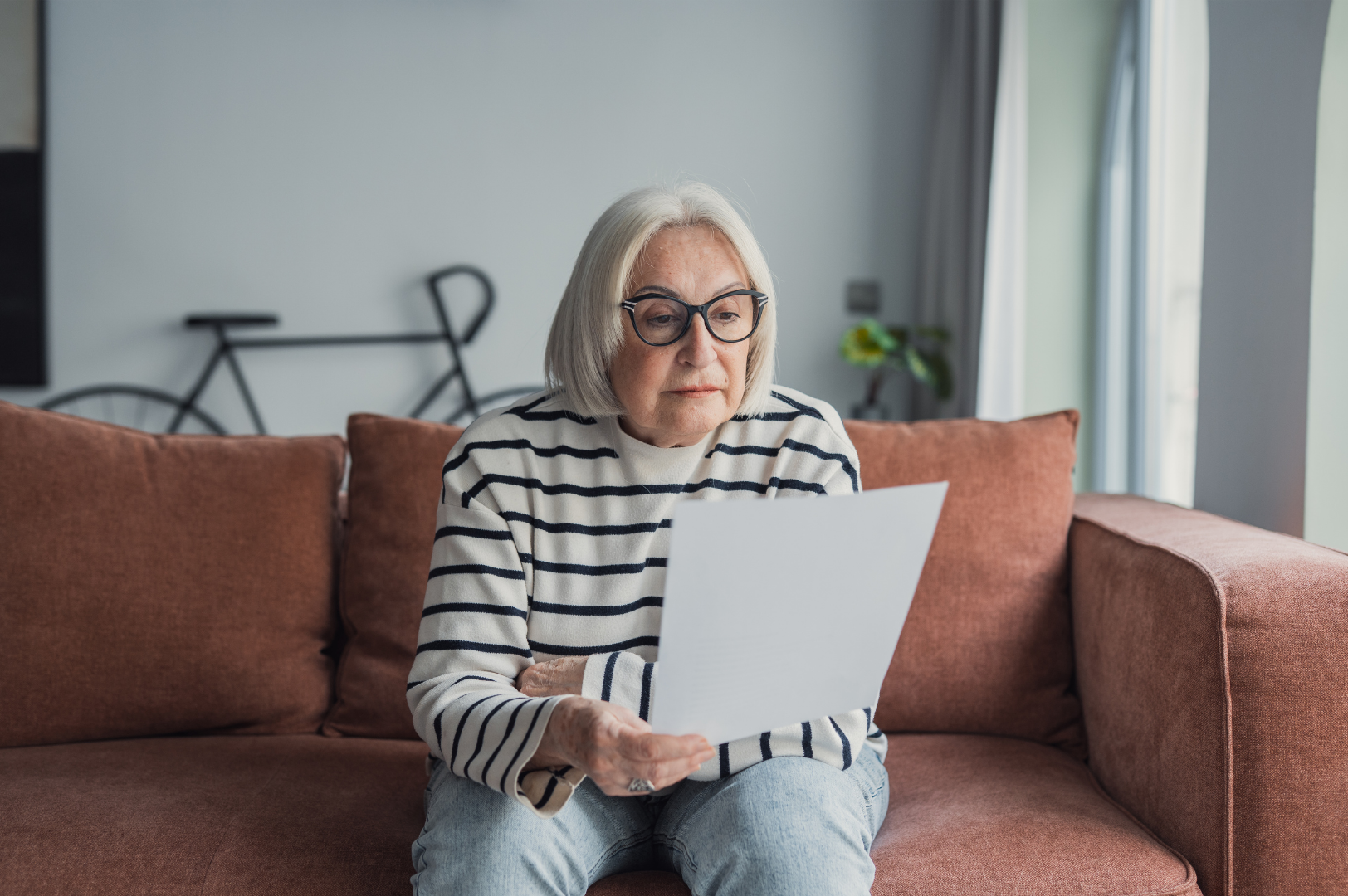 Person looking over paperwork with concern