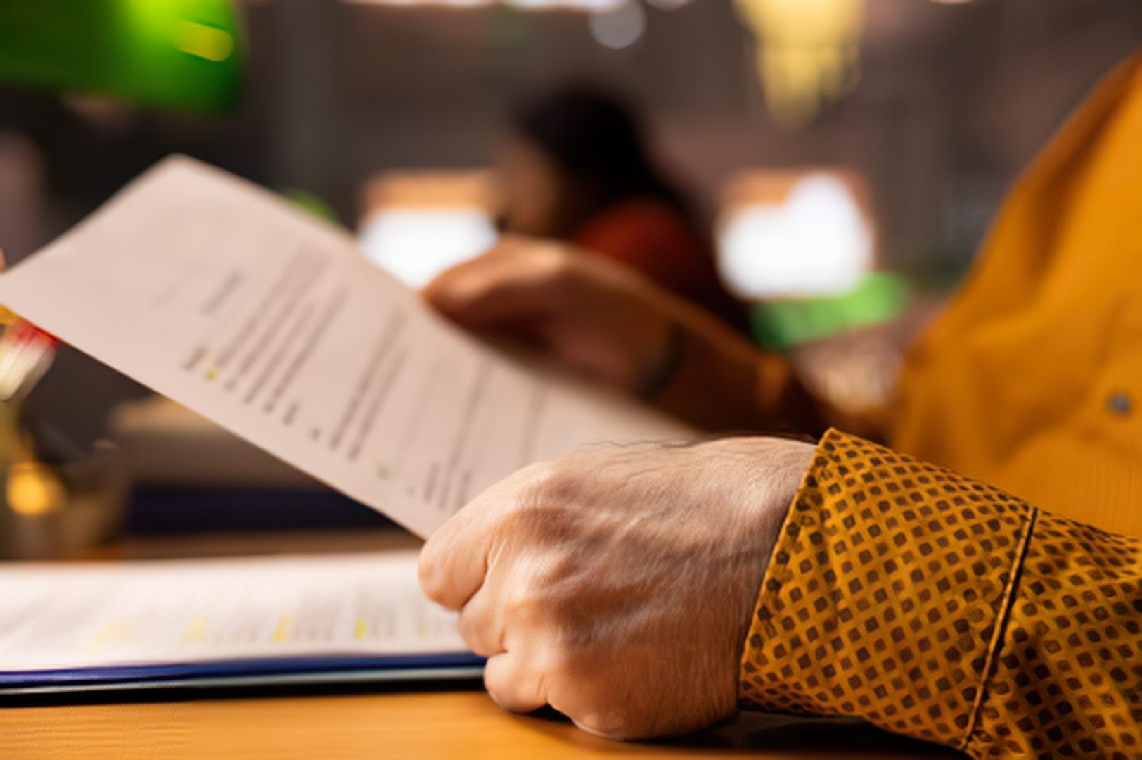 Person looking over paperwork with concern