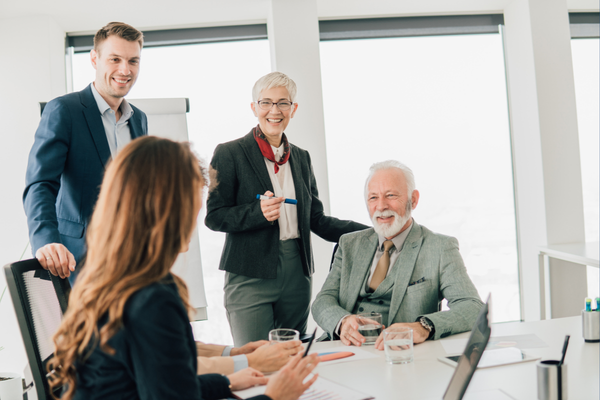 Multigenerational workforce collaborating in modern office