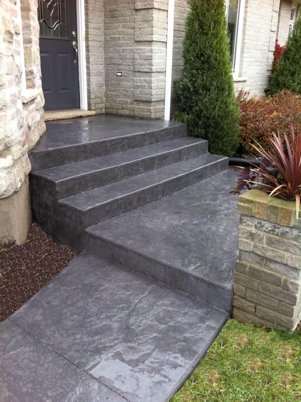 Newly installed concrete front steps at a home in Mississauga