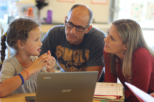 Children working with a mentor