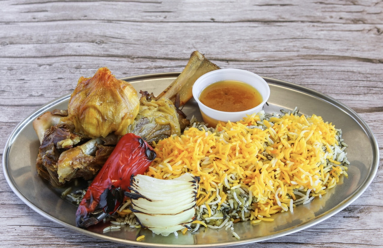Braised Persian lamb shank served with dill rice at Chop Kabob, Westborough