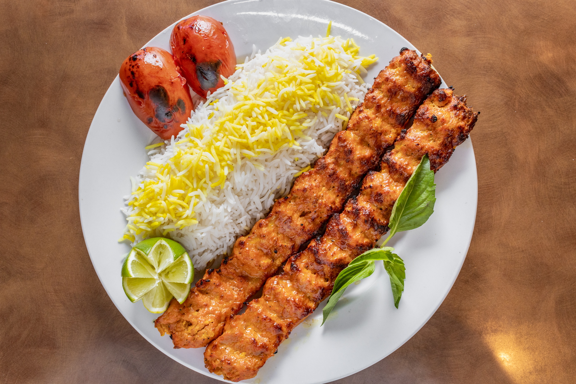 Chicken Koobideh — grilled seasoned ground chicken skewers with saffron rice at Chop Kabob