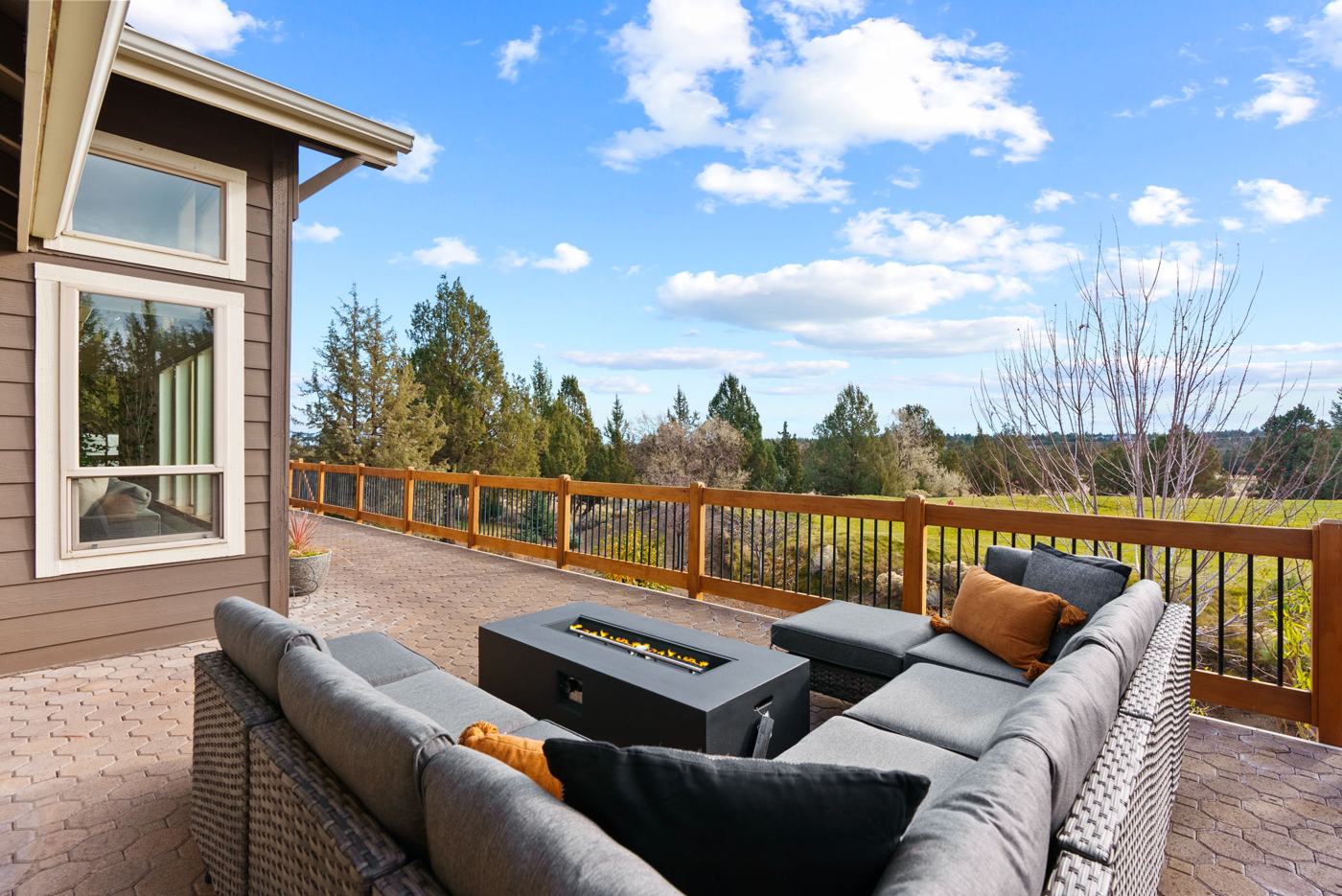 Deck with fire table and a view over the Eagle Crest golf course in Redmond, Oregon