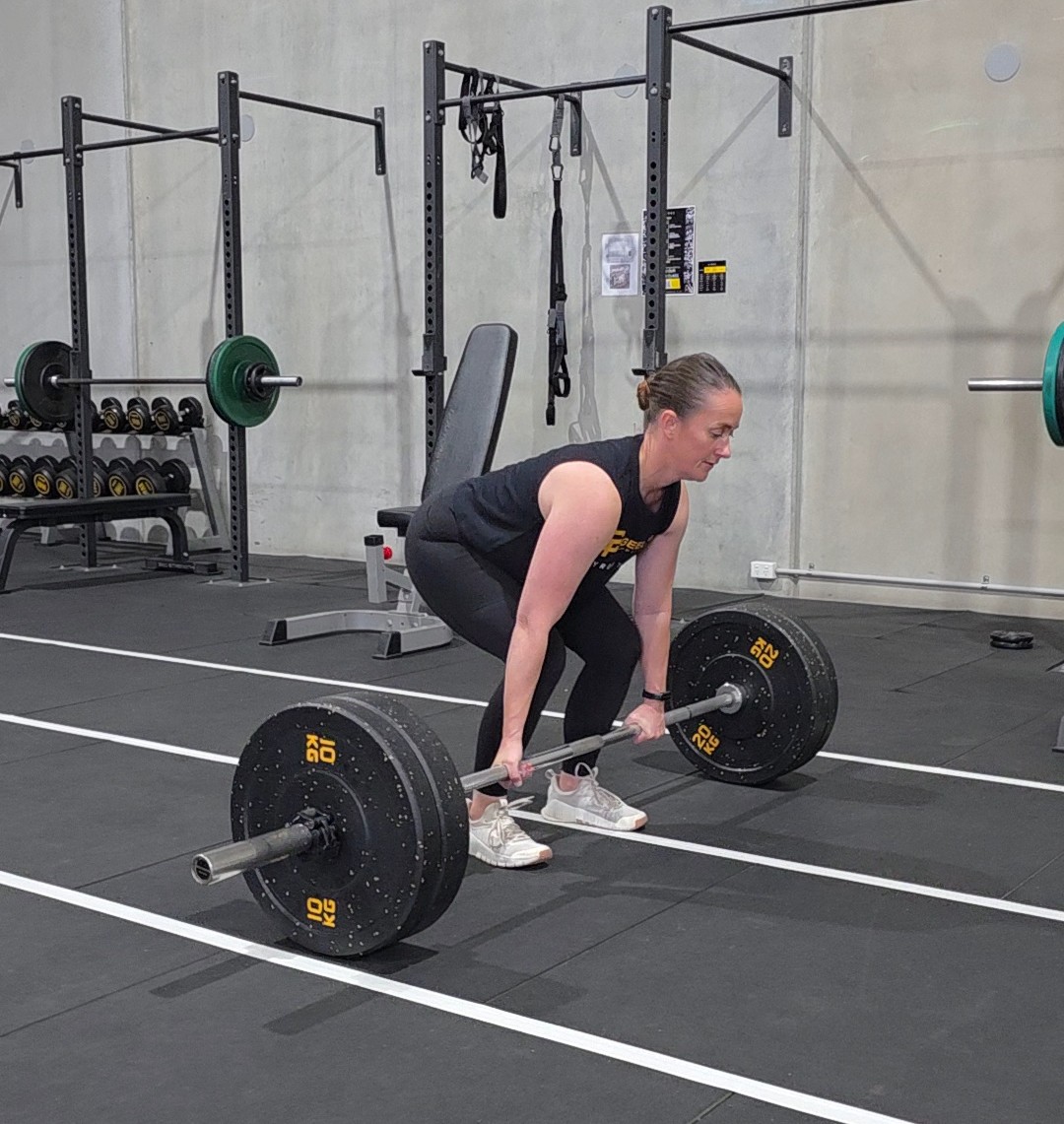 Member deadlifting