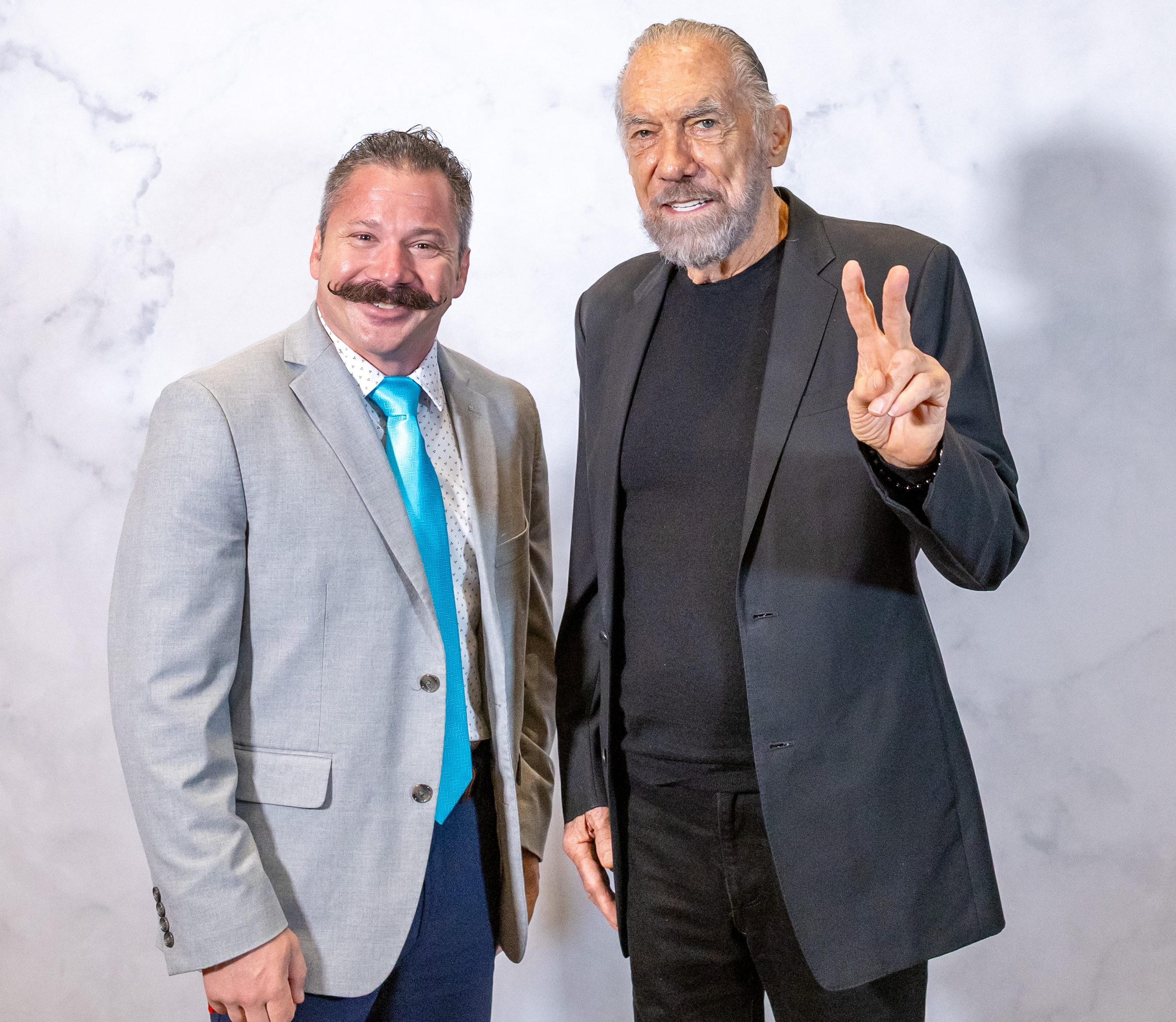 Alex Buriak with John Paul DeJoria, co-founder of Paul Mitchell and Patrón