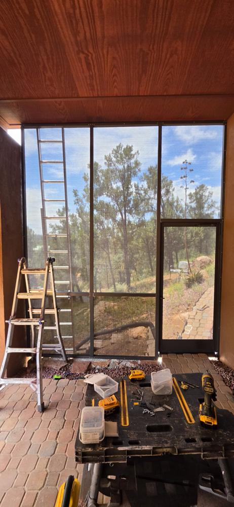Finished screen room looking out at the pines