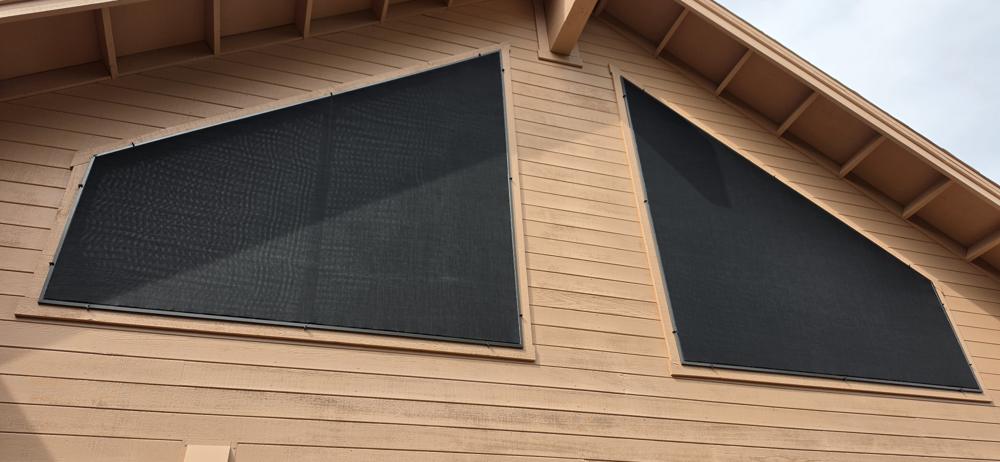 Solar screens on triangular gable windows