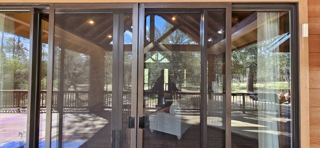 Sliding screen door on a patio slider