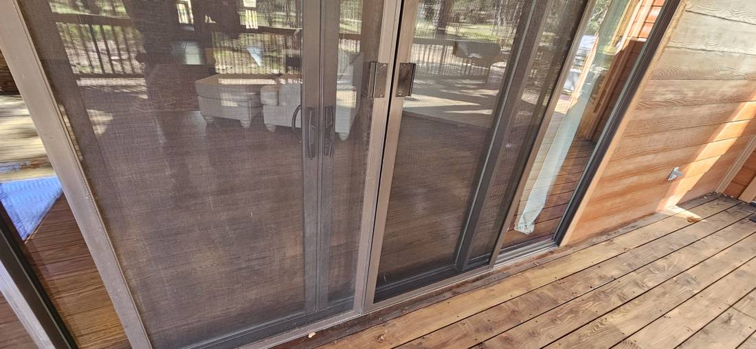 Sliding screen door on a deck