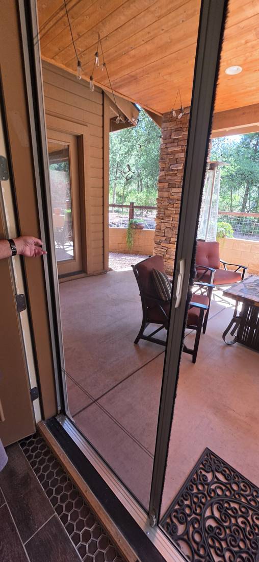 Retractable screen door on a patio doorway