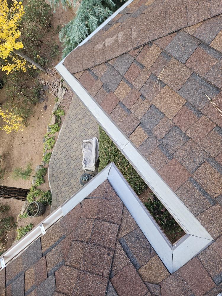 Micromesh gutter guard installed along roof corners and a valley