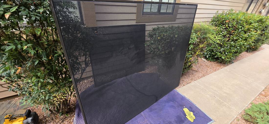 Solar screen half cleaned with Screen Magic