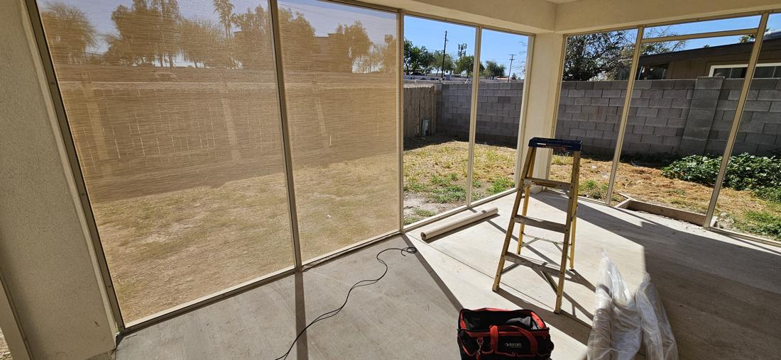 Screen being installed in the new screen room frames