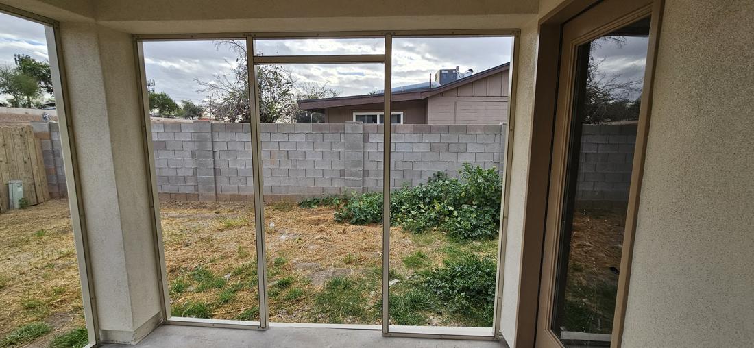 Door opening framed into a screen room wall