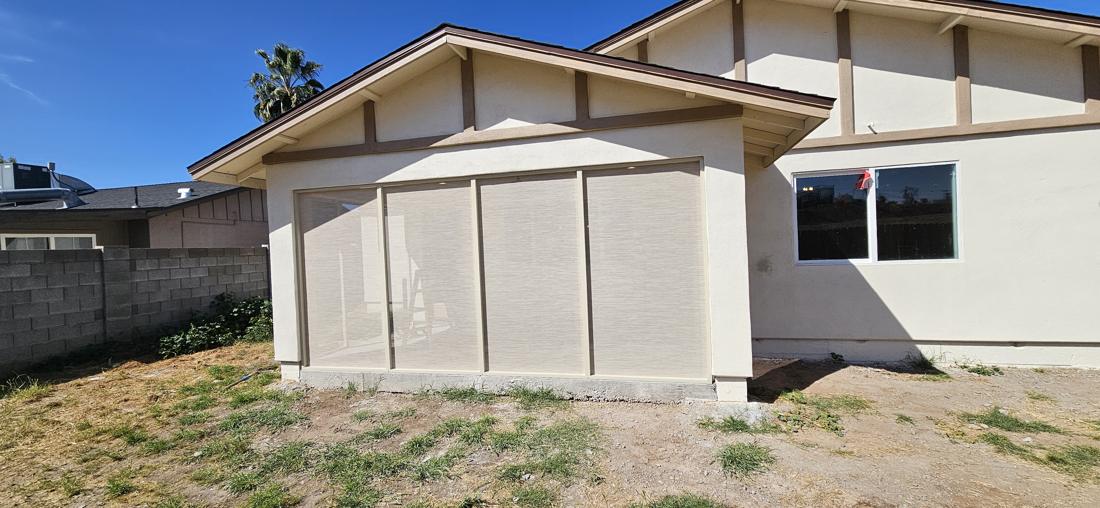 Fully enclosed patio screen room from the yard
