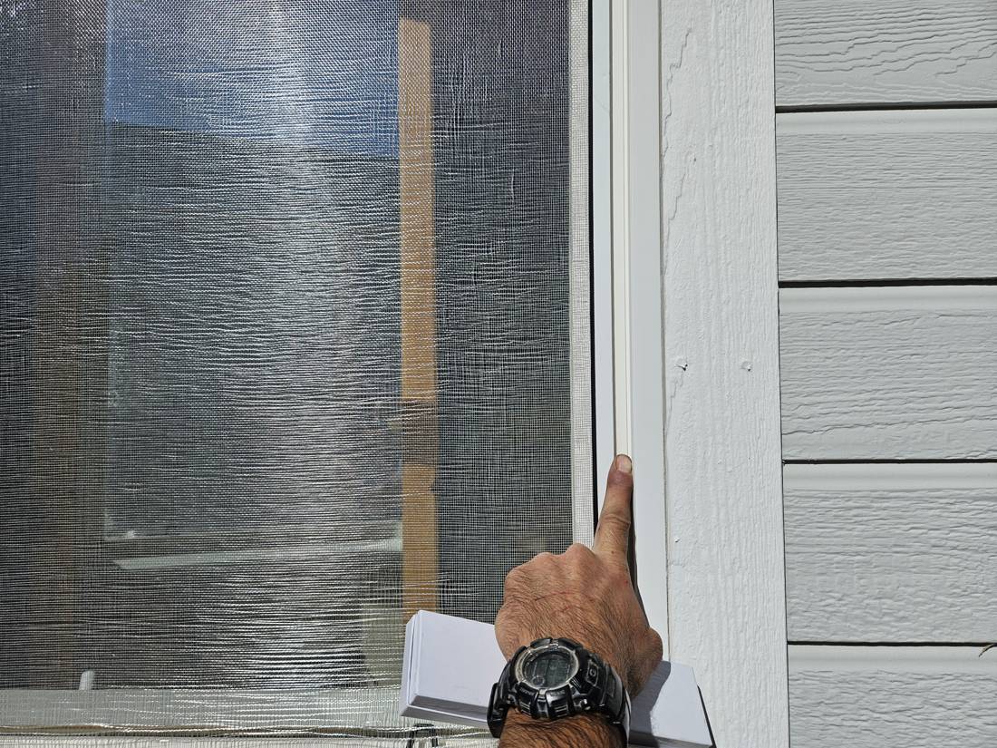 Technician pointing out wear on an old screen