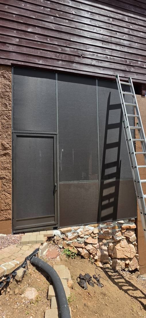 Tall screen room walls with a screen door