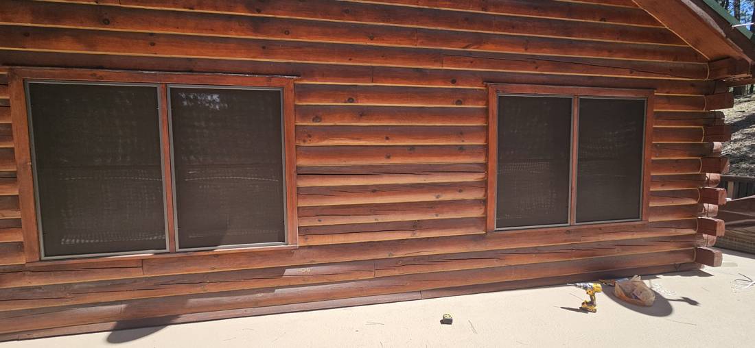 Solar screens on a log home