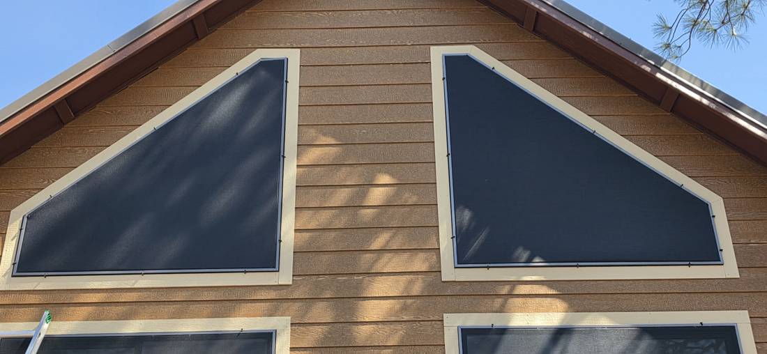Solar screens on angled gable windows