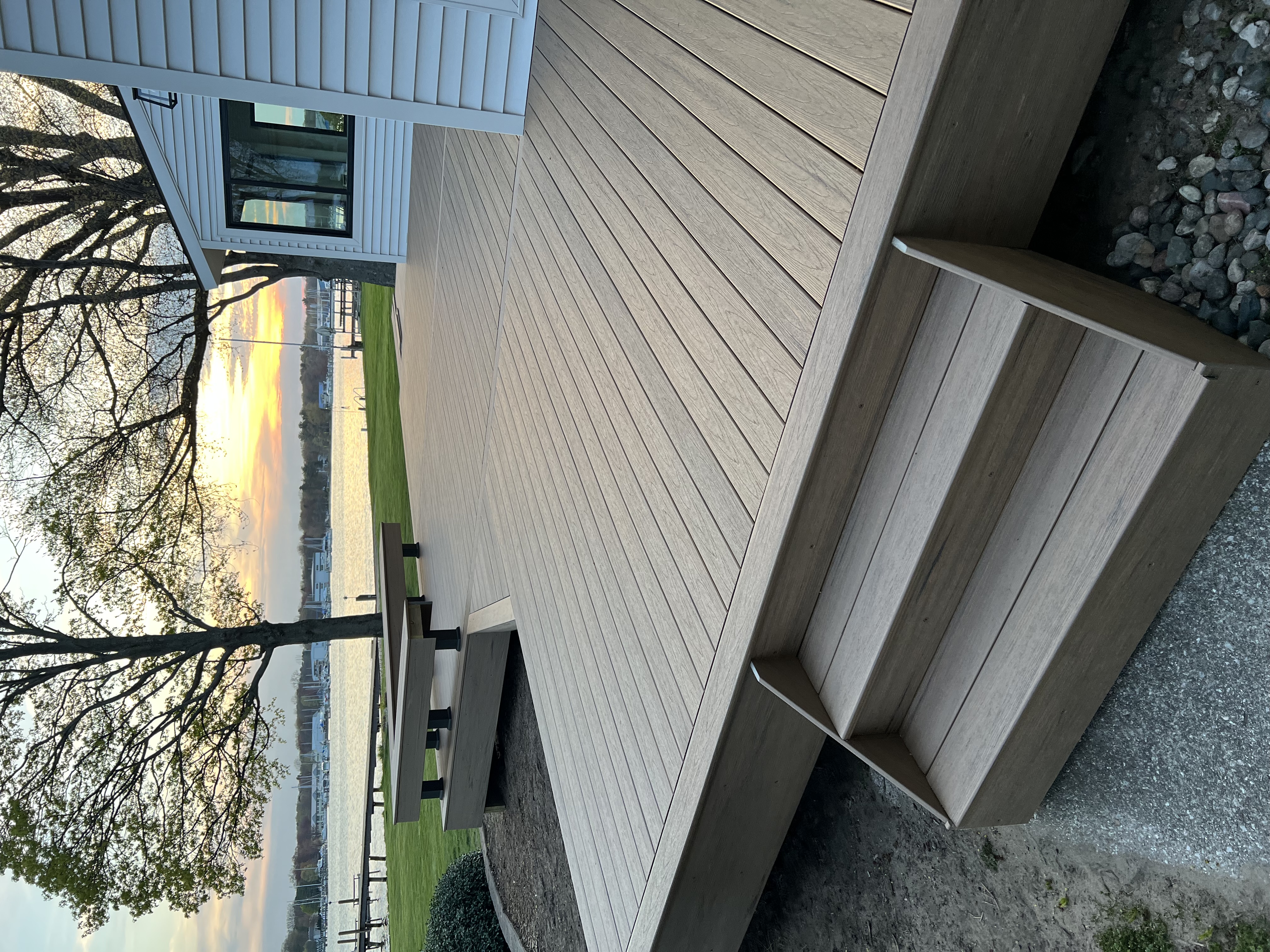 Completed residential deck with landscaping at a West Michigan home