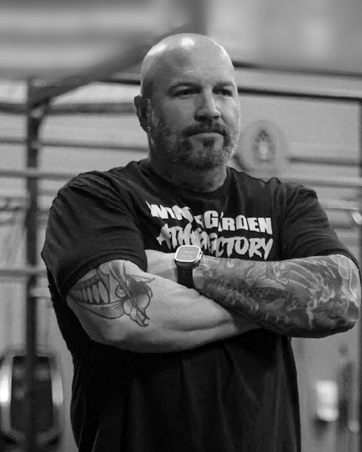 Lee Lovette, arms crossed, in a Winter Garden Athlete Factory shirt