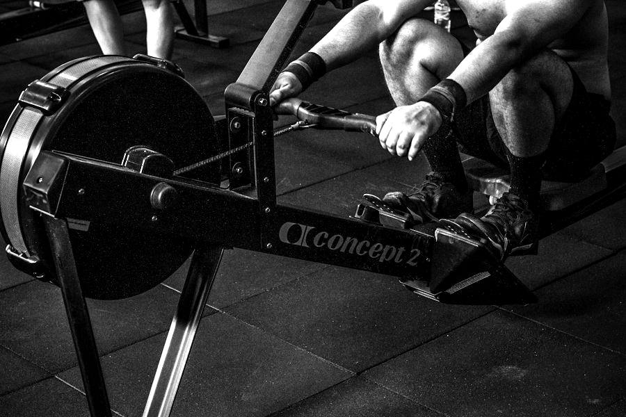 Athlete pulling hard on a rowing machine
