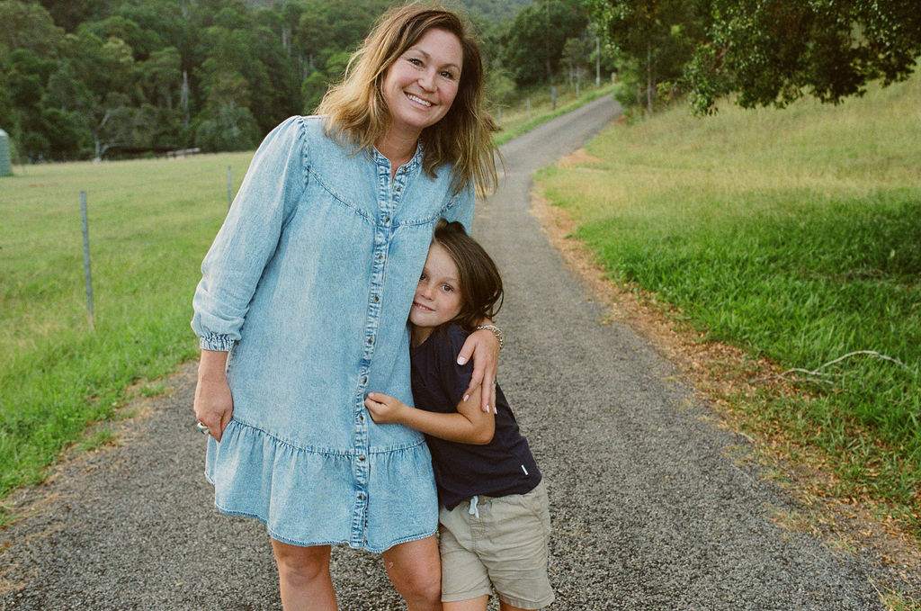 Jaime hugging her daughter on the farm track