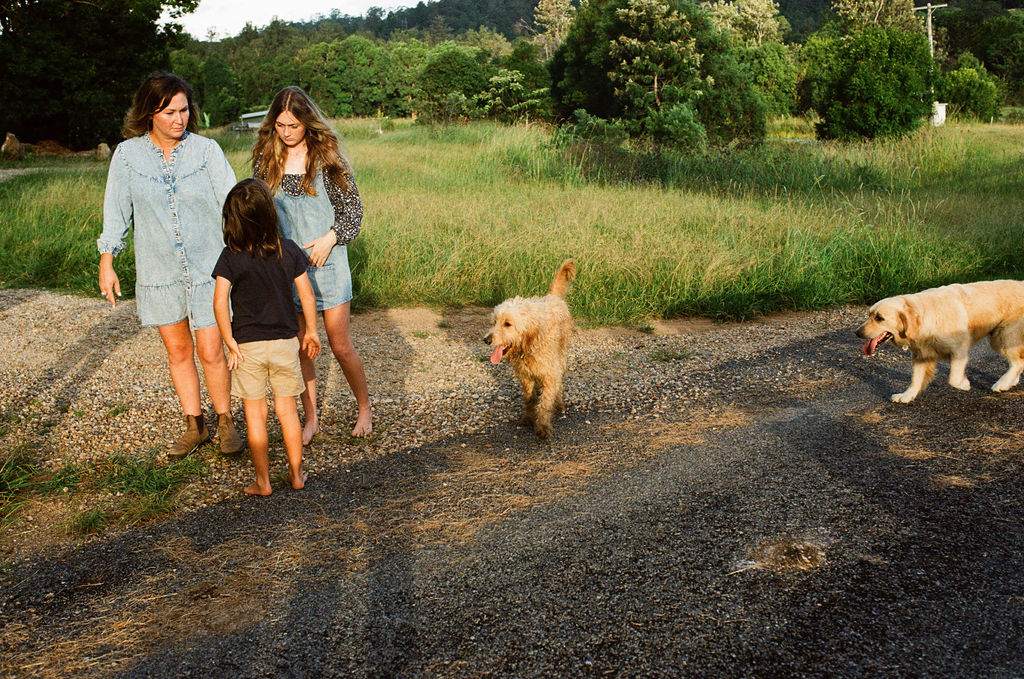 The Stefanac family walking up the farm track with their dogs