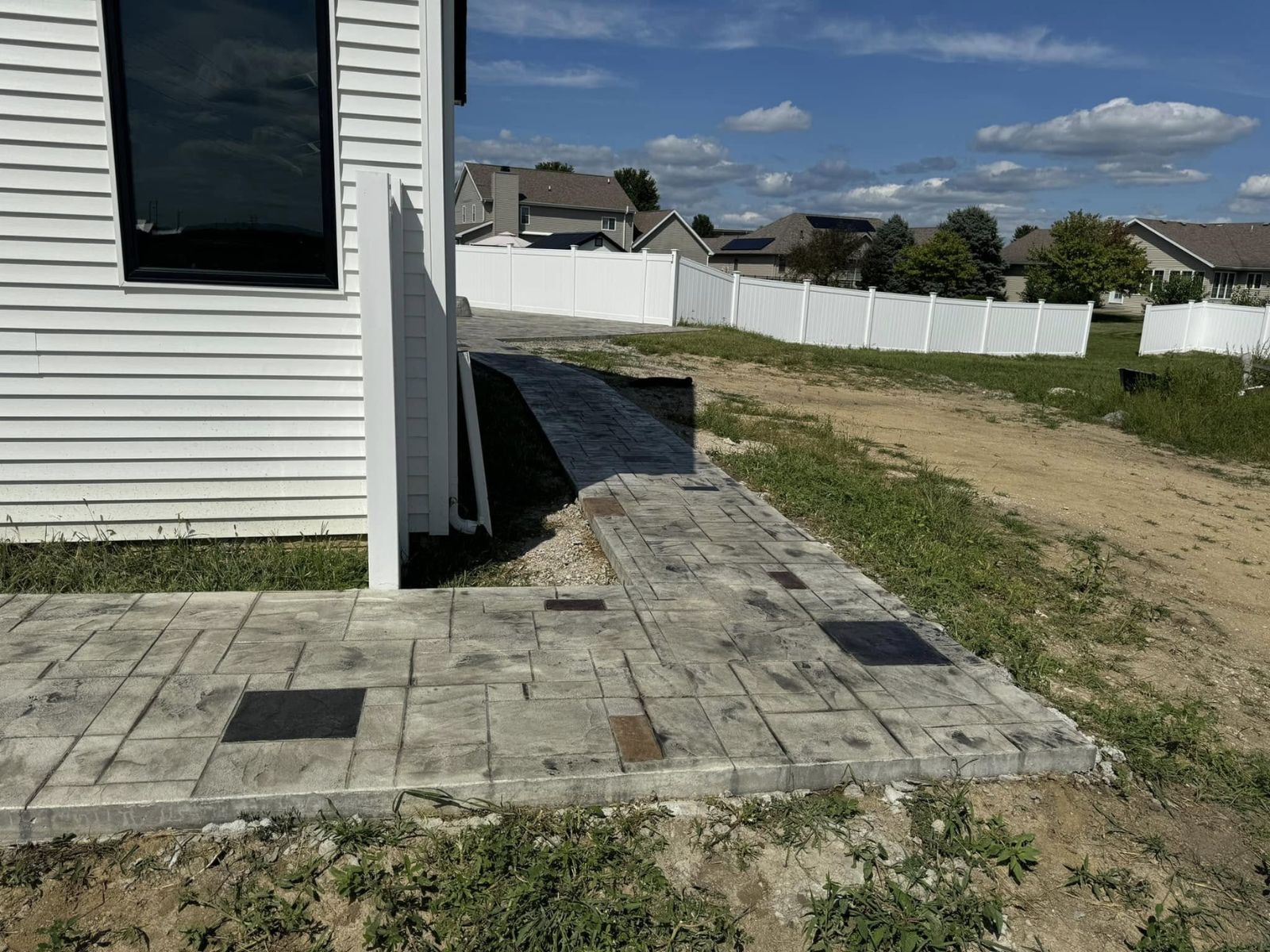 Concrete walkway connecting property destinations