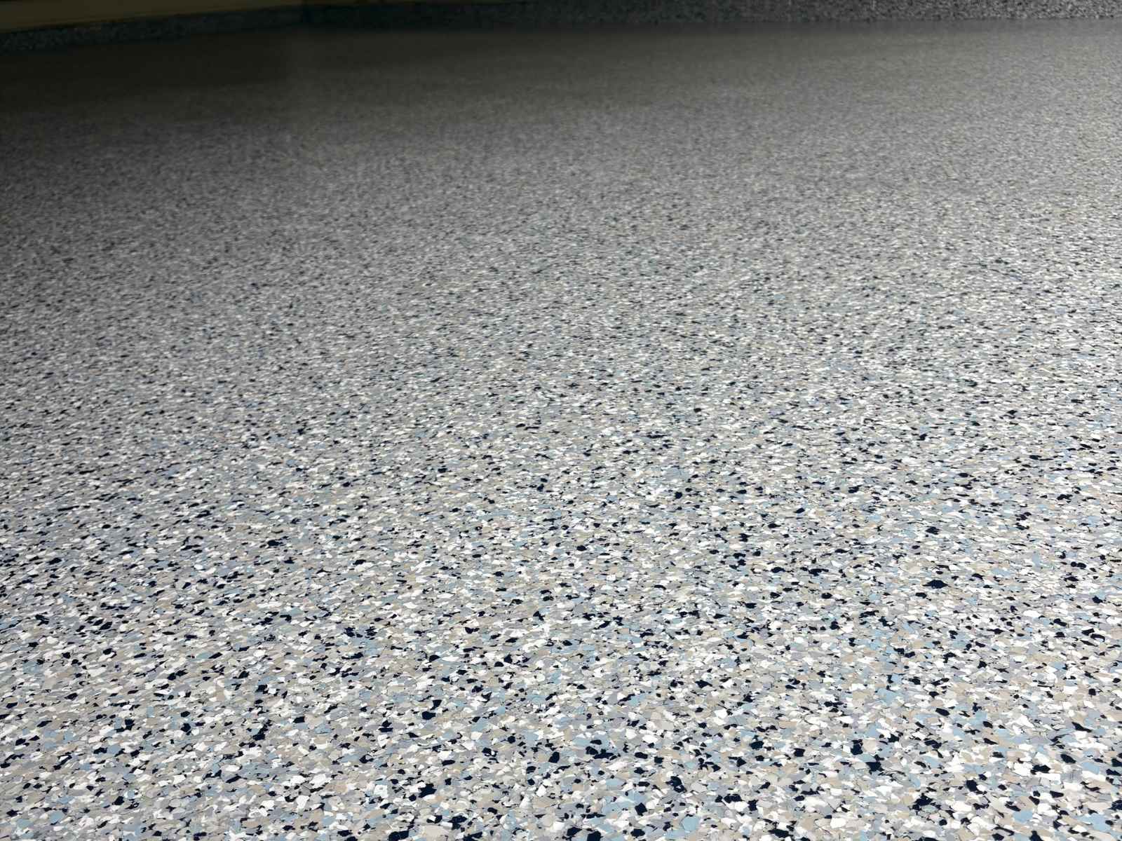 Coated garage floor surface