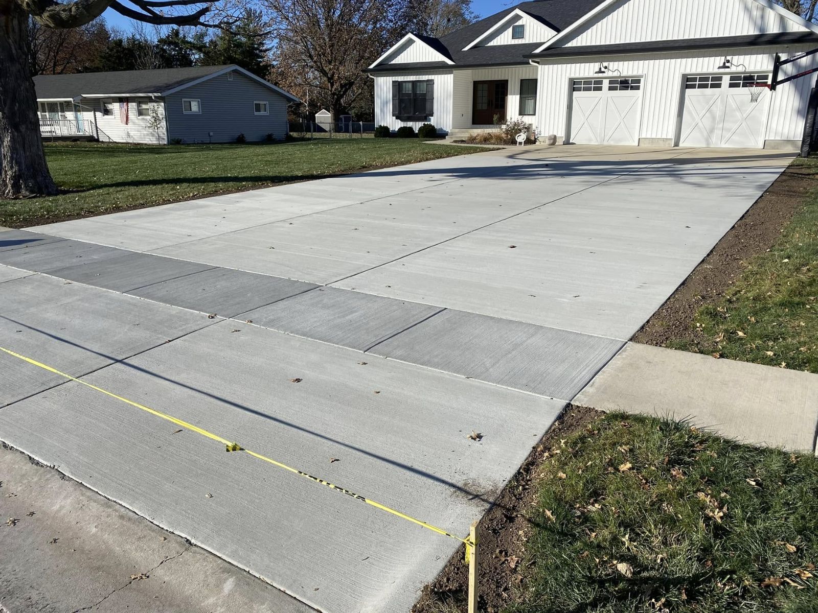 Concrete driveway approach to a home