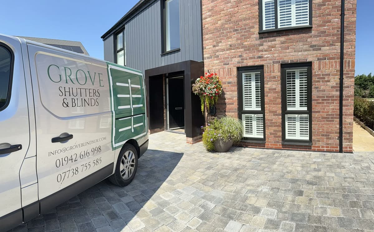 The Grove Shutters & Blinds van outside a home fitted with shutters