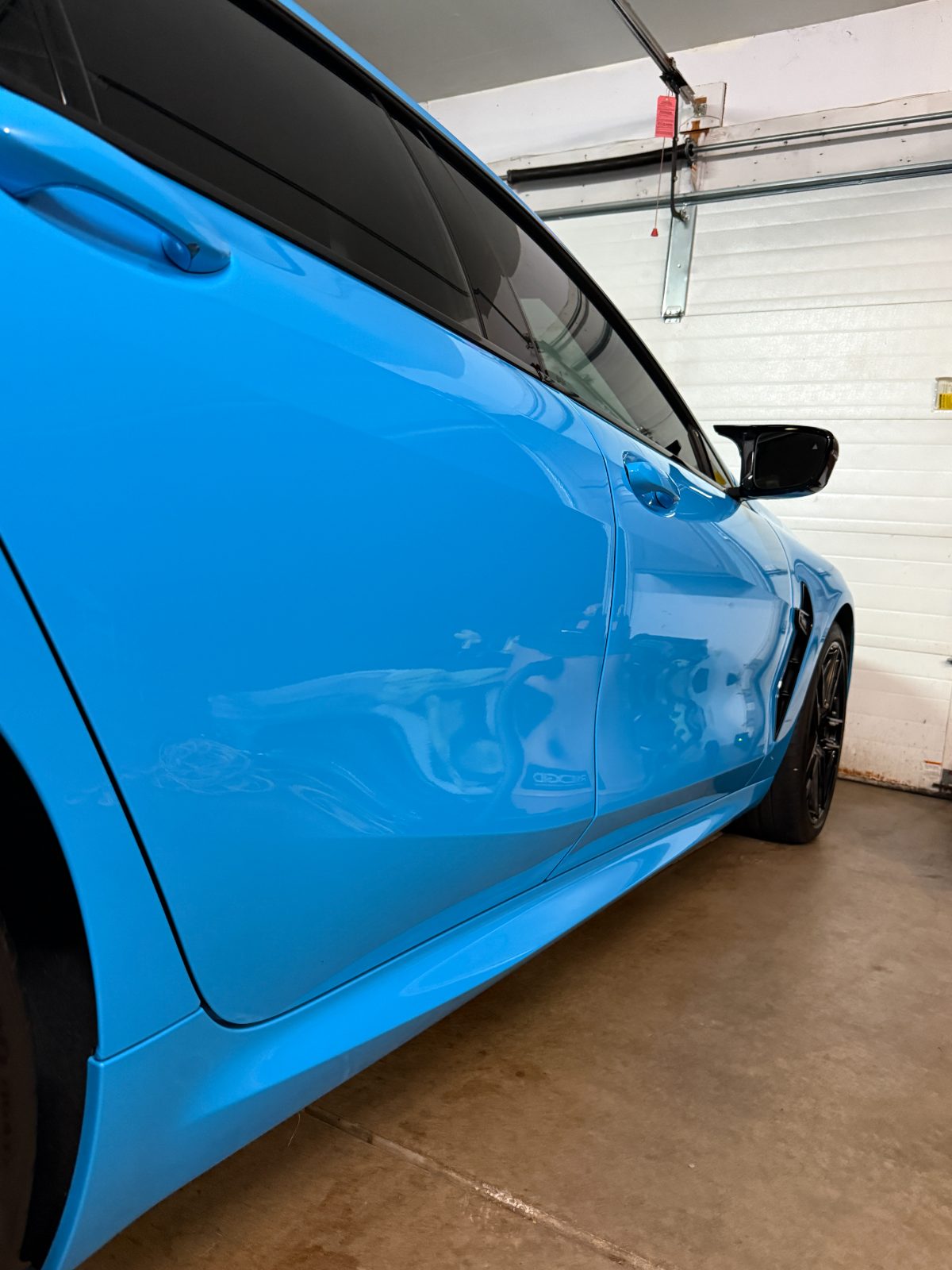Riviera-blue BMW M8 with a mirror-deep ceramic gloss — ceramic coating Eau Claire