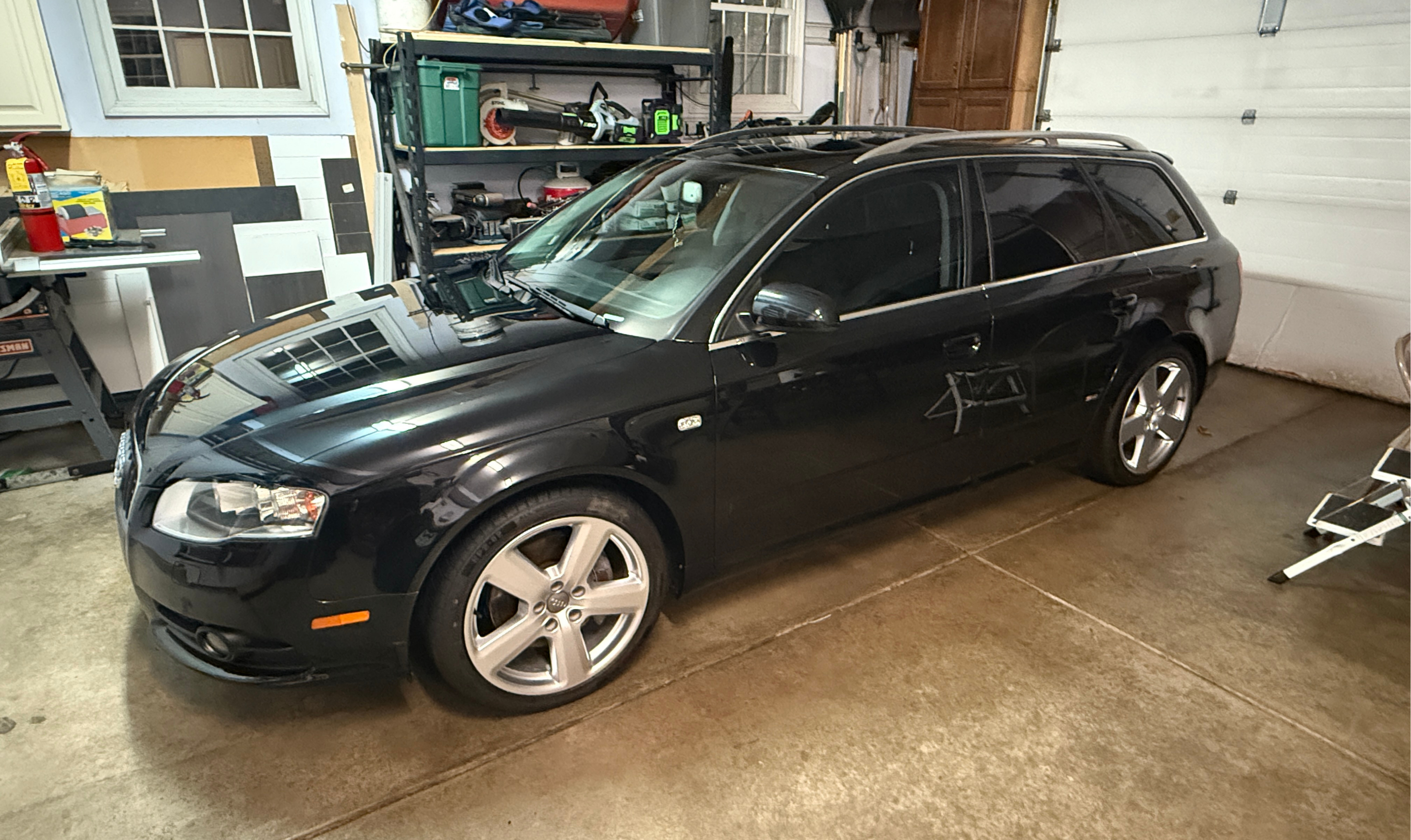 Black Audi wagon with mirror-deep ceramic finish — ceramic coating Eau Claire