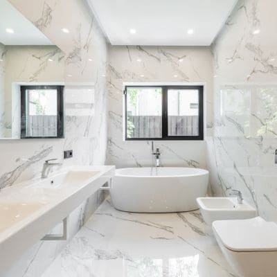 High-end bathroom renovation with marble walls