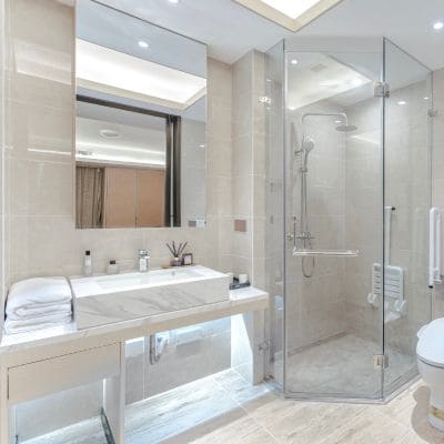 Elegant bathroom renovation with a large glass-enclosed shower